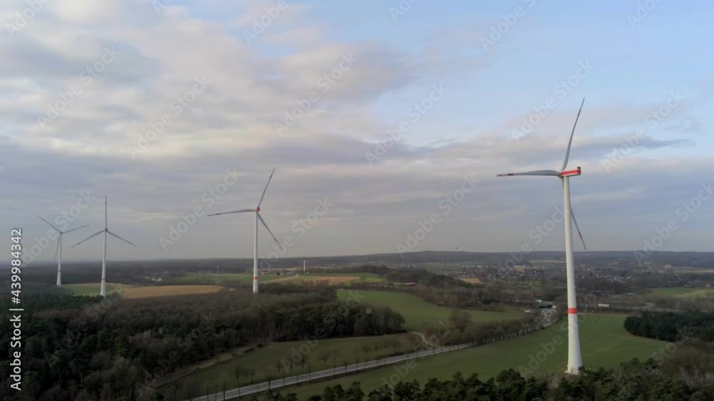 Wind Turbines Array by the Road in Landscape of Germany. Alternative Sustainable Energy Concept, Drone Shot Wind Turbines Array by the Road in Landscape of Germany. Alternative Sustainable Energy Concept, Drone Shot