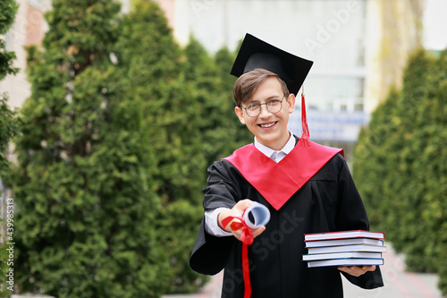 Portrait of male graduating...