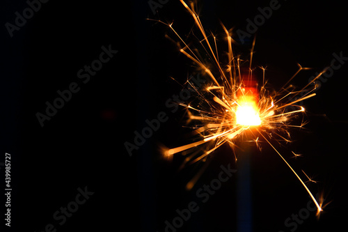 A sparkler is a type of handheld firework that burns slowly while emitting colored flames, sparks, and other effects.