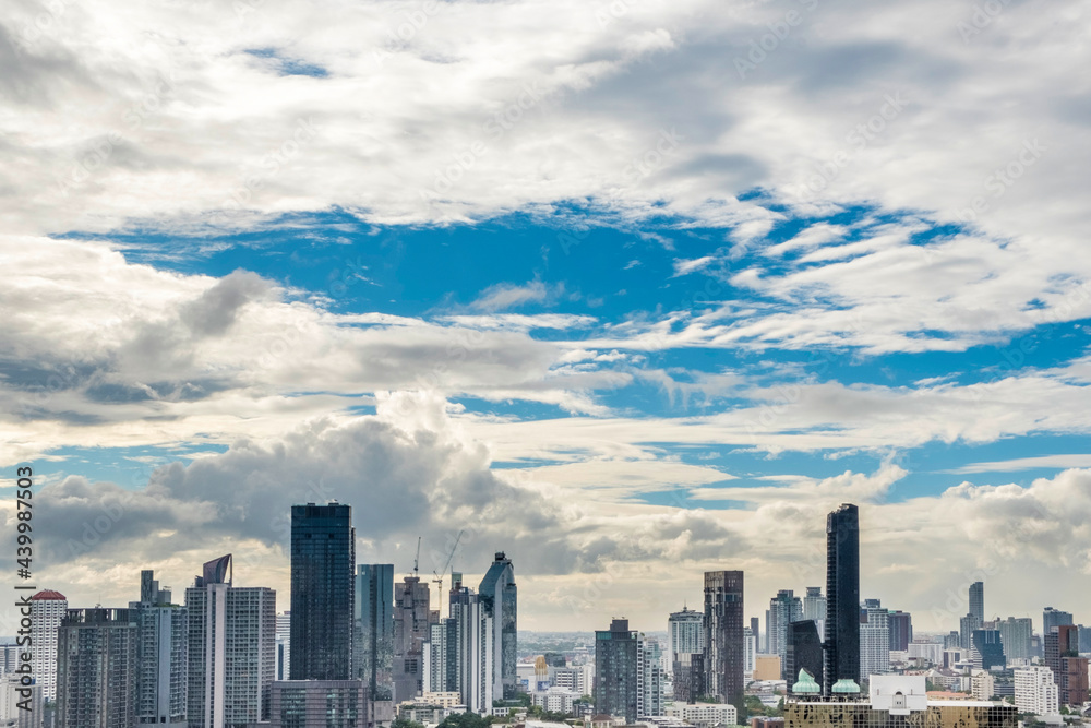 A partly cloudy sky over the Thong Lo district in downtown Bangkok, Thailand