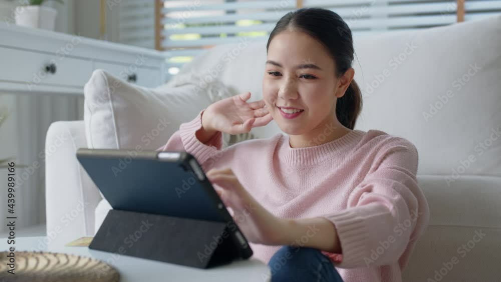 Young asia people 5G wifi digital device user teen girl watch read news play social media, e-commerce iot data app, pay money, remote shop retail store at home sofa couch sit easy relax happy smile. Young asia people 5G wifi digital device user teen girl watch read news play social media, e-commerce iot data app, pay money, remote shop retail store at home sofa couch sit easy relax happy smile.