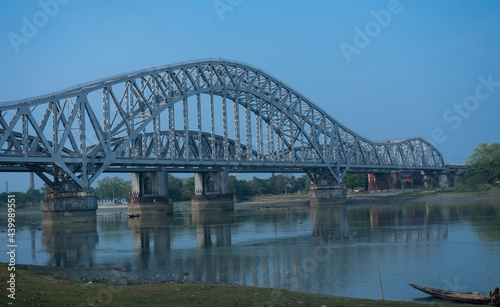 A steel railway bridge over a clam river | Hooghly steel railway bridge named 'Sampreeti Bridge'