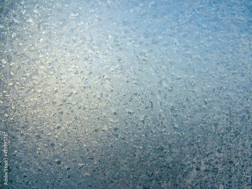 Icy pattern on frozen window glass
