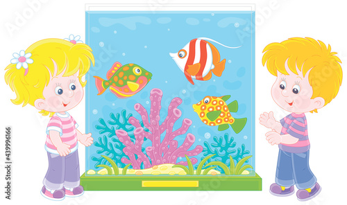 Happy little kids walking around a zoological garden and watching funny tropical fishes swimming in a large colorful aquarium with amazing corals, vector cartoon illustration