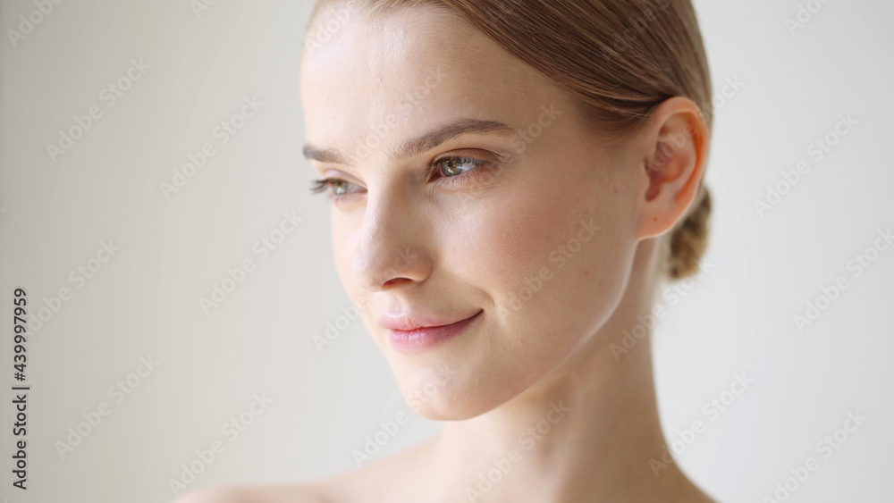Beautiful woman face close up blonde short hair natural make up