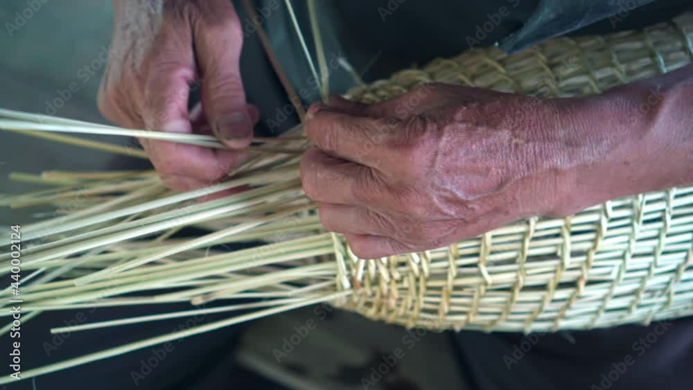 Footage b roll of Thai people made fish trap bamboo. Thai culture Northeast. Older man made fish trap. Local wisdom