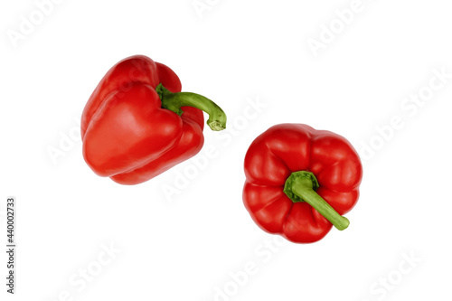 Two red sweet peppers isolated on white background top view.