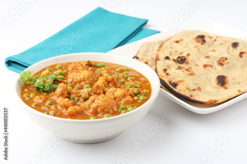 Mix vegetable curry with Naan or Indian bread and raita, Indian meal