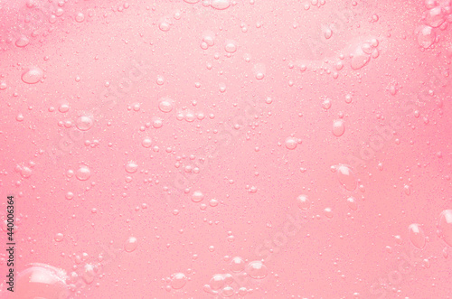 Fotografie Gentle soft pink slime with gold glitter and shimmer with bubbles texture