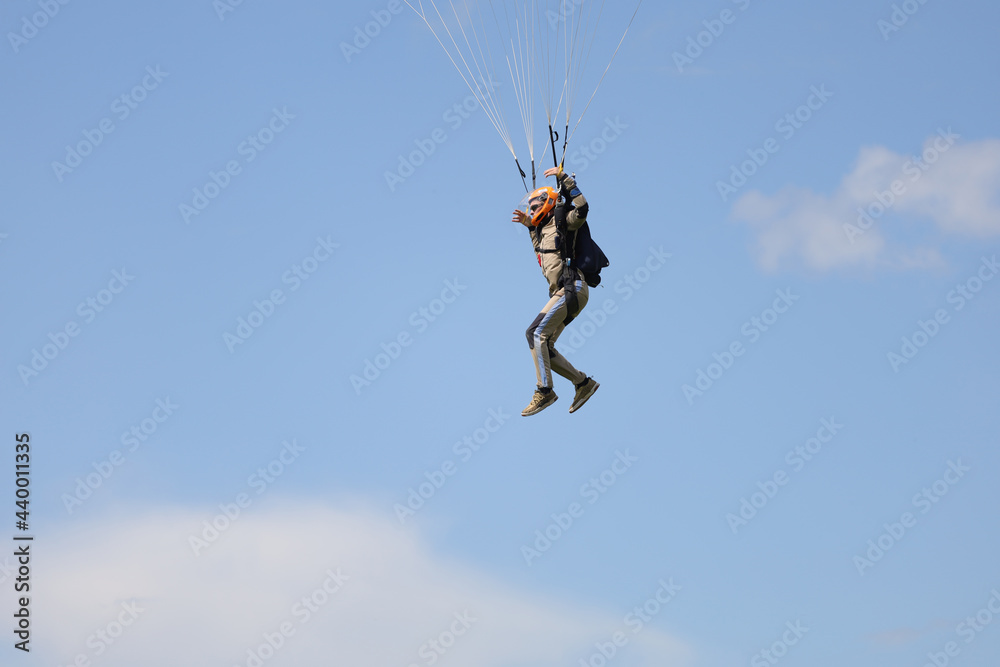 Skydiving. A skydiver is landing.