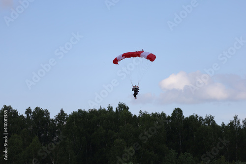 Skydiving. A young woman is landing.