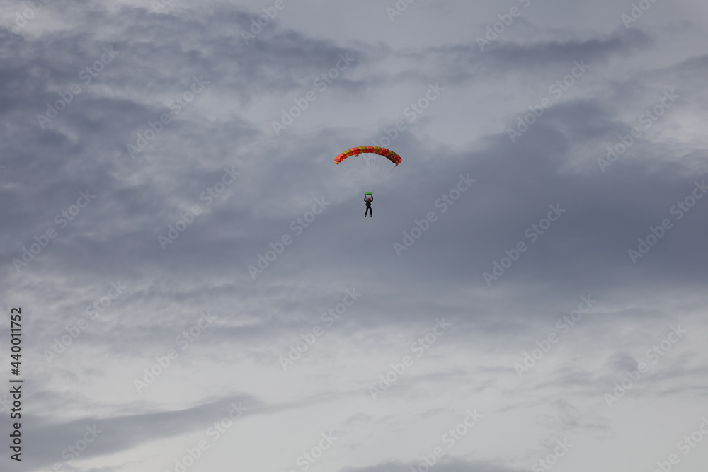 Skydiving. Cloudy sky and a parachute in the sky. Skydiving. Cloudy sky and a parachute in the sky.