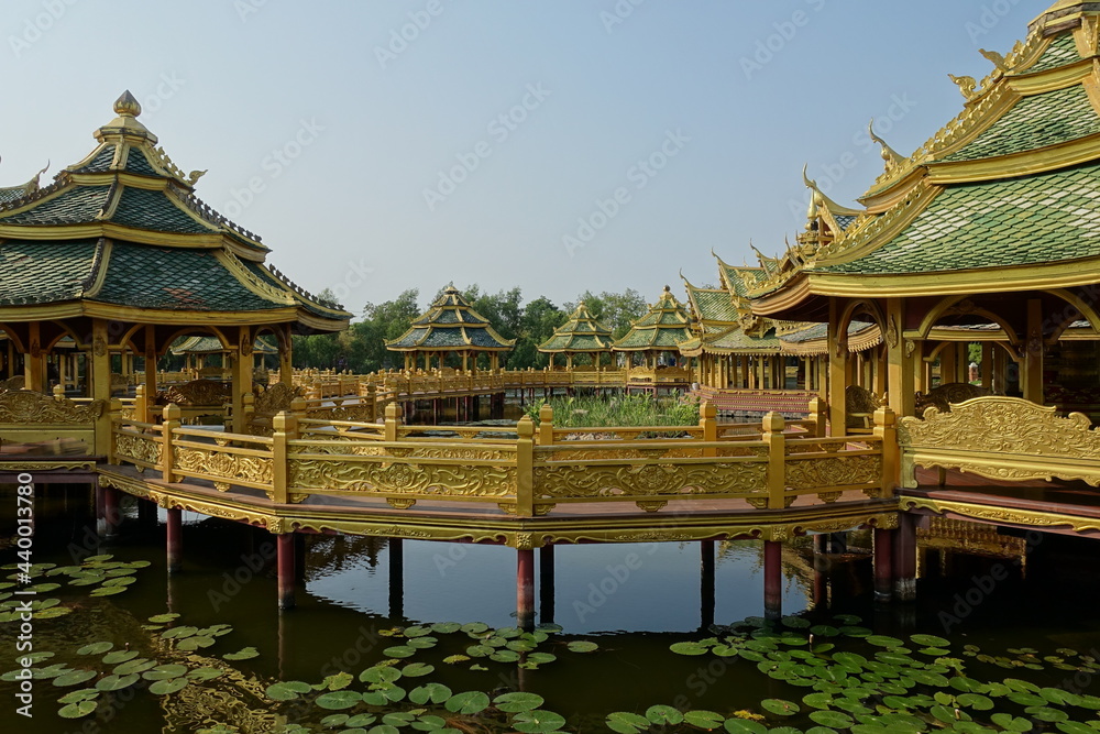 Pergolas on the water, connected by bridges, in the ancient Thai style. 