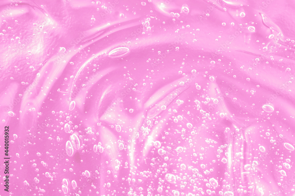 Obraz premium Hyaluronic acid with retinol and ceramide swatch. Pink toner smear smudge texture. Gel serum liquid cosmetics, cream with collagen sample. Jelly cleanser cosmetic product. Close-up, macro.