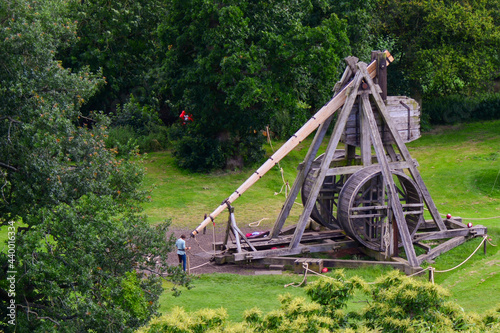Canvastavla Person standing near a trebuchet in Warwick, England, the UK