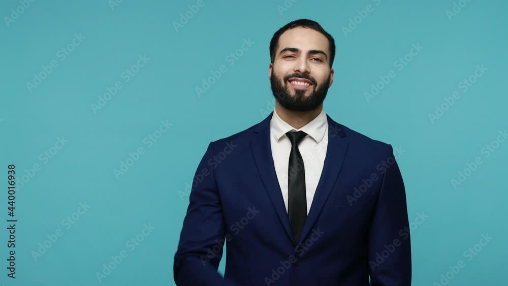 This is me! Proud handsome brunette bearded man in black suit smiling happily and pointing himself, feeling confident, egoistic person. Indoor studio shot isolated on blue background. This is me! Proud handsome brunette bearded man in black suit smiling happily and pointing himself, feeling confident, egoistic person. Indoor studio shot isolated on blue background.