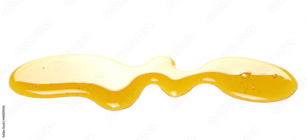 Honey puddle isolated on white background 