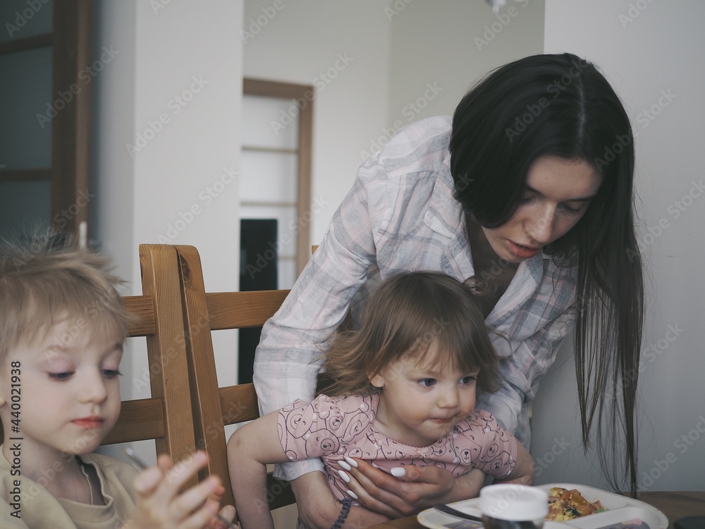 the family has breakfast in the kitchen the family has breakfast in the kitchen