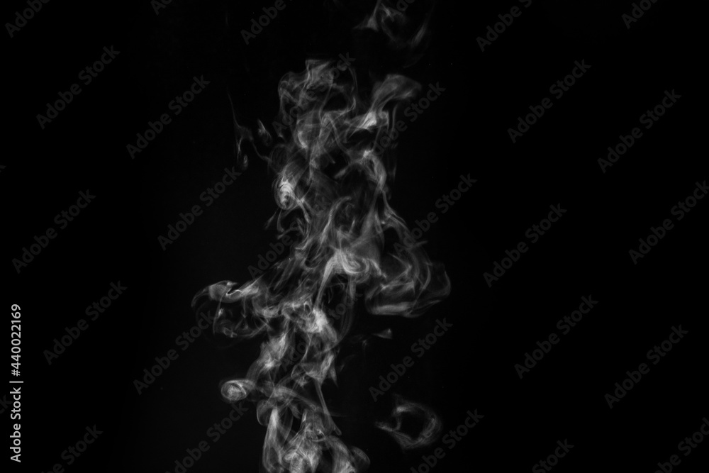 White smoke on black background. Figured smoke on a dark background. Abstract background, design element White smoke on black background. Figured smoke on a dark background. Abstract background, design element