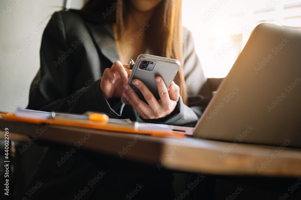 businesswoman hand using smart phone, tablet payments and holding credit card online shopping, omni channel, digital tablet docking keyboard computer at office