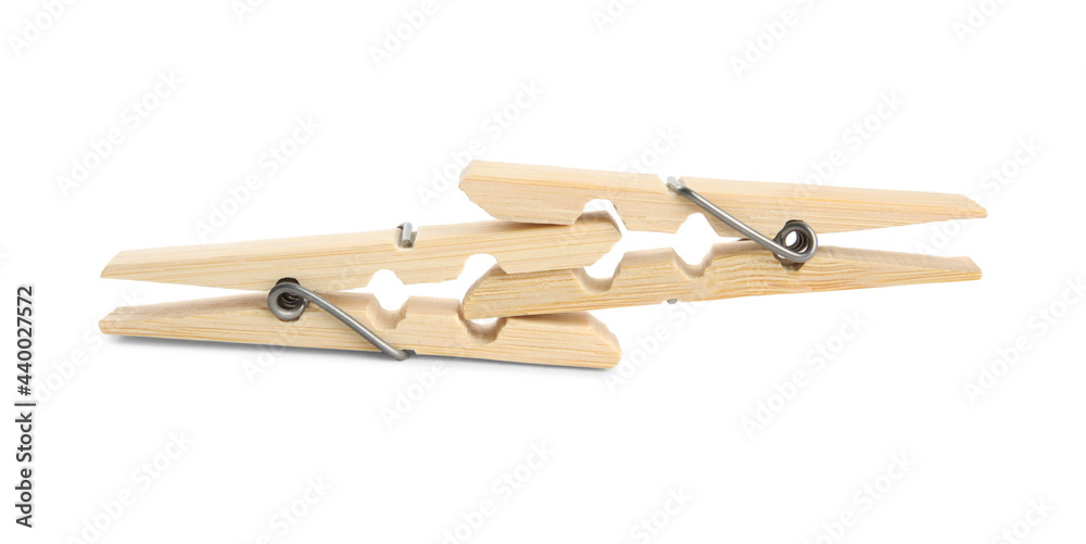 Two classic wooden clothespins on white background Two classic wooden clothespins on white background