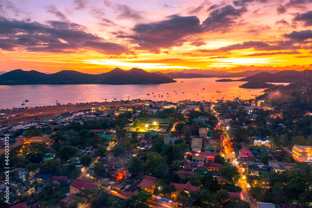 Amazing tropical sunset at the sea at Coron island, Busuanga, Philippines. Sea aerial view.