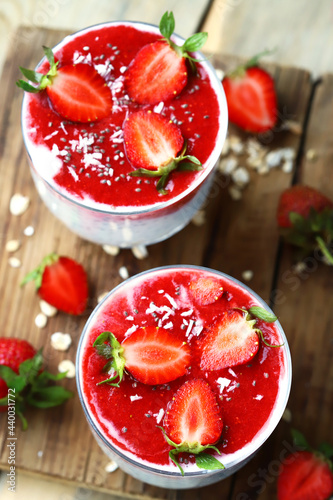 Chia yogurt with strawberry topping. Healthy summer dessert with strawberries. Keto dessert.