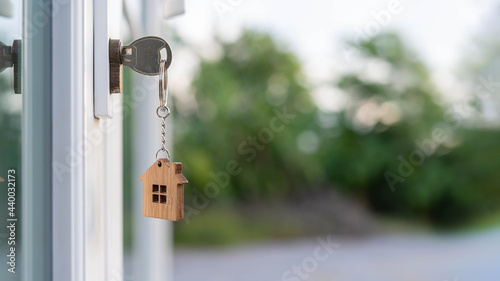 The house key for unlocking a new house is plugged into the door. © Shisu_ka