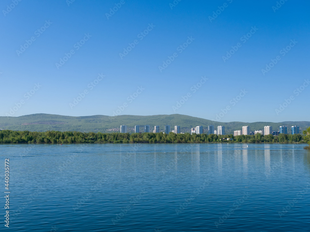 The Yenisei River. View of the city of Krasnoyarsk. Summer sunny day. Clear sky