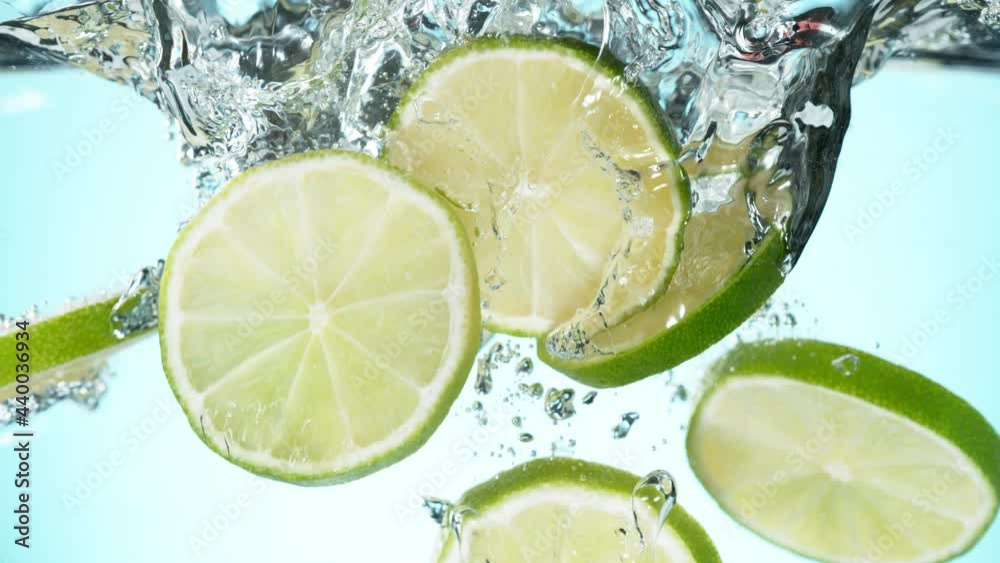 Super slow motion of falling lime slices into splashing water. Filmed on high speed cinema camera, 1000 fps.