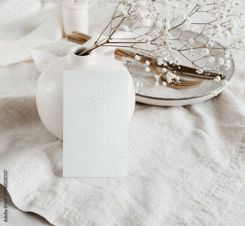 Сard mockup on empty modern minimal table place setting neutral beige color ....