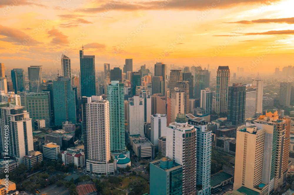 Beautiful sunset of Skyscrapers and shopping malls in Makati, Philippines Metro Manila region and financial hub.