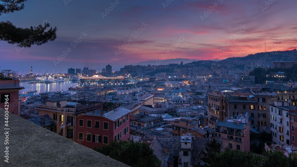 View of the port of Genoa at sunset from Spianata Castelletto, Italy.