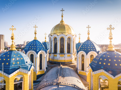 St. Vladimir's Cathedral in Kyiv. Aerial drone top view. Space for text. Kyiv city at sunrise from the height of bird benefits. photo