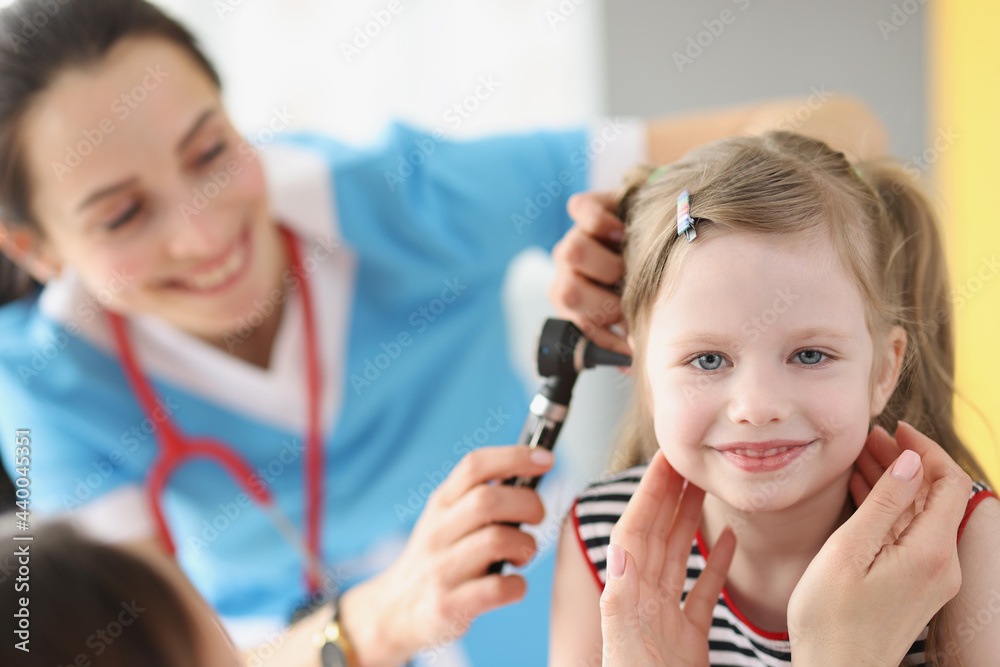 Child with otitis media attending pediatric otolaryngologist at hospital Child with otitis media attending pediatric otolaryngologist at hospital