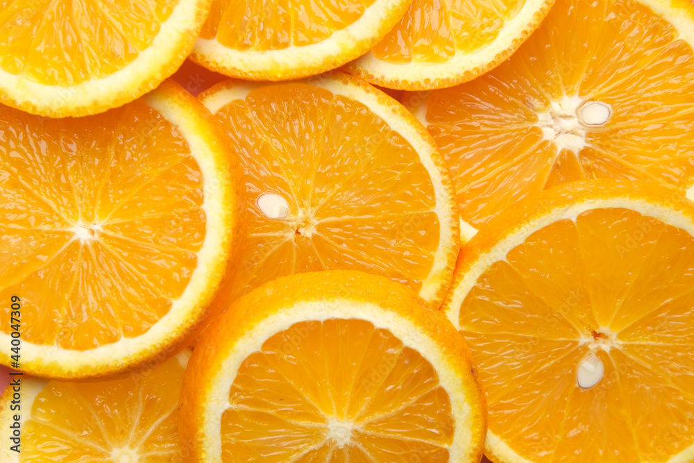 close up of slice of orange fruit on color background close up of slice of orange fruit on color background