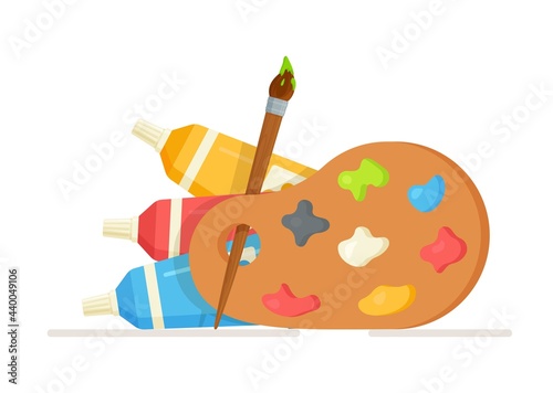 Vector illustration of an isolated palette with different colors and an inserted brush dipped in green paint. Drawing of creative materials for design workshops. 