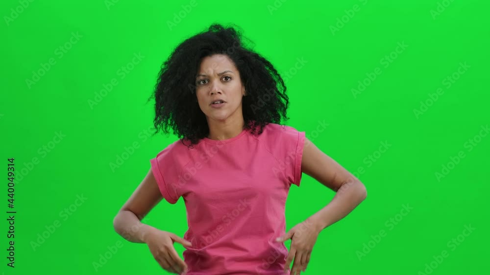 Portrait of young female African American swears and shakes viciously ...