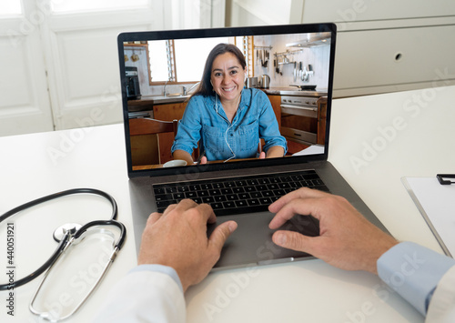 Online medical care. Woman on computer screen video calling online doctor in virtual consultation