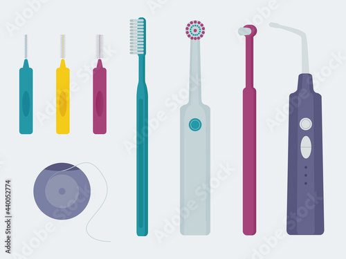 Set of items for dental care with braces. Monopuckle toothbrush, electric toothbrush, interdental brushes, dental floss and irrigator, depicted in a flat style.