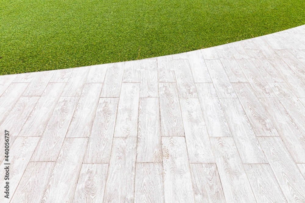 White wooden floors and green artificial turf outside the building pattern and background seamless