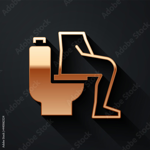 Gold Men sitting on the toilet and Constipation are experiencing severe abdominal pain icon isolated on black background. Long shadow style. Vector