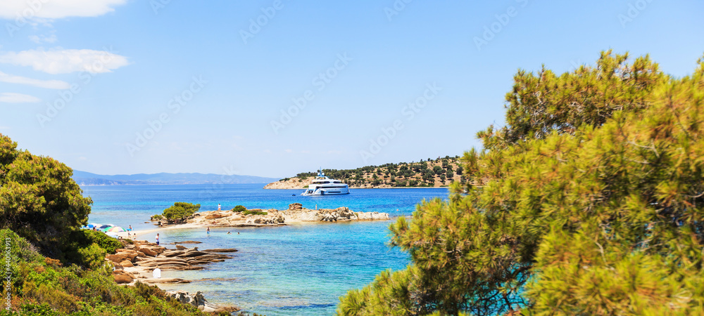 Wonderful summer seascape of turquoise sea water and yacht at co