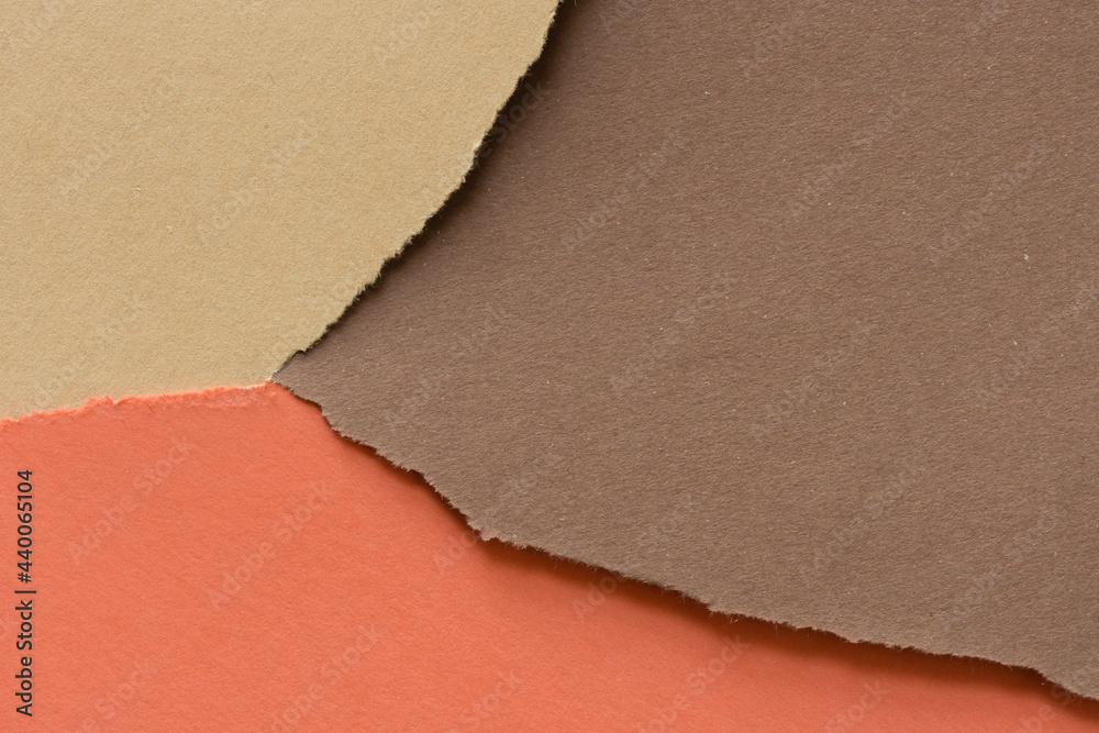 Fototapeta premium ripped paper background in analogous colors (orange sand brown)