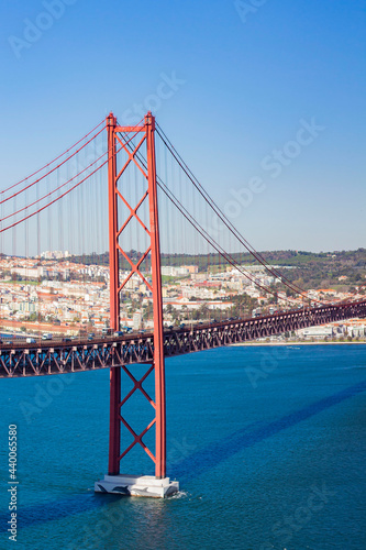 View from Almada of suspension  Ponte 25 de Abril bridge (The 25th April Bridge) over river Tejo, Tegaus in Lisbon, Portugal. Bridge alike Golden gate in Portugal. 