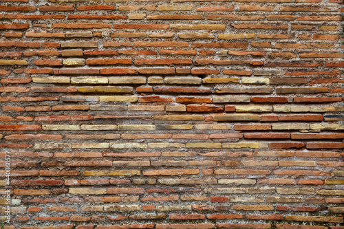 Ancient brickwork of flat roman bricks