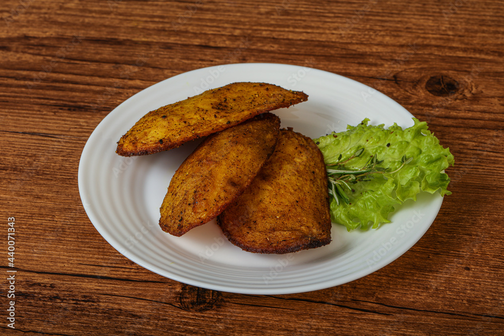 Baked potato with herbs and spices Baked potato with herbs and spices