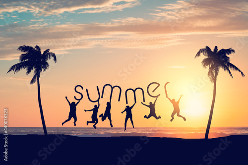 Silhouette friends jumping and holding summer words on sunset sky with palm tree abstract background at tropical beach. Travel holiday and freedom feel good concept.