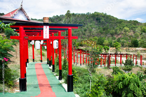 Red torii gate of Wat Khao Sung Chaem Fa temple on Khao Sam Sip Hap mountain for thai people and foreign travelers travel visit and respect praying at Tha Maka on May 23  2021  Kanchanaburi  Thailand