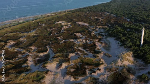  Drohnenvideo morgendliche Dünenlandschaft beim Dueodde Fyr Leuchtturm auf Bornholm, Dänemark  photo